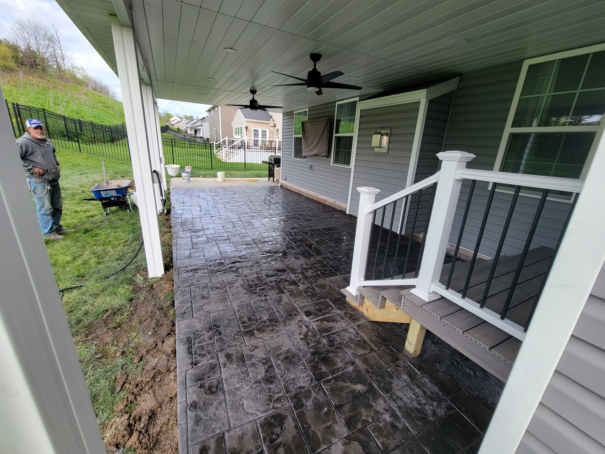 Stamped concrete patio installation at modern home